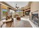 Spacious living room features a fireplace and built-in entertainment center at 24686 N 120Th Pl, Scottsdale, AZ 85255