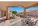 Covered patio with outdoor seating and mountain views at 24686 N 120Th Pl, Scottsdale, AZ 85255