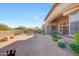 Private backyard patio with seating area, desert landscaping, and mountain views at 24686 N 120Th Pl, Scottsdale, AZ 85255