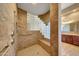 Walk-in shower with glass block wall and built-in seat at 24686 N 120Th Pl, Scottsdale, AZ 85255