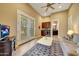 Sitting room with a wet bar, sofa, and French doors at 24686 N 120Th Pl, Scottsdale, AZ 85255