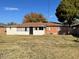 Spacious backyard with grassy lawn and single-story home at 2525 E Roma Ave, Phoenix, AZ 85016