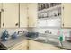 View of the vintage kitchen sink and cabinetry at 2917 W Diana Ave, Phoenix, AZ 85051