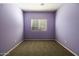 Purple bedroom with window and carpet at 44469 W Canyon Creek Dr, Maricopa, AZ 85139