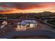 Stunning aerial view of a new construction home with desert landscape at sunset at 475 W Saddle Mountain Road --, Phoenix, AZ 85086