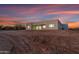 Rear view of single story home showcasing sunset at 475 W Saddle Mountain Road --, Phoenix, AZ 85086