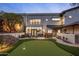 Home features a putting green, patio furniture, and beautiful landscaping at 5317 N 46Th St, Phoenix, AZ 85018