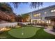 Luxury home with putting green, patio, and seating area at 5317 N 46Th St, Phoenix, AZ 85018