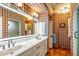 Bathroom with double vanity and plaid wallpaper at 5317 N 46Th St, Phoenix, AZ 85018