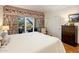 Bedroom with patio doors and floral decor at 5317 N 46Th St, Phoenix, AZ 85018