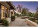 Stone patio with seating area and beautiful landscaping at 5317 N 46Th St, Phoenix, AZ 85018