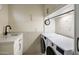 Bright laundry room with washer, dryer, and ample counter space at 5317 N 46Th St, Phoenix, AZ 85018