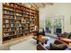 Large library with hardwood floors and a wall of bookshelves at 5317 N 46Th St, Phoenix, AZ 85018
