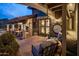 Stone patio with comfortable seating and a large clock on the wall at 5317 N 46Th St, Phoenix, AZ 85018
