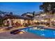 Stunning pool and spa with a spacious patio and lounge chairs at 5317 N 46Th St, Phoenix, AZ 85018