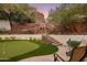 Landscaped backyard putting green with waterfall feature at 5317 N 46Th St, Phoenix, AZ 85018
