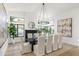 Bright dining room with large windows, chandelier, and modern decor at 5421 E Cannon Dr, Paradise Valley, AZ 85253