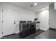 Laundry room with modern appliances and hexagon tile floors at 5421 E Cannon Dr, Paradise Valley, AZ 85253