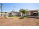 Landscaped backyard with artificial turf and storage shed at 6306 W Mitchell Dr, Phoenix, AZ 85033