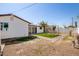 Backyard with artificial turf and brick pathway at 6306 W Mitchell Dr, Phoenix, AZ 85033