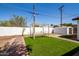 Backyard view with artificial turf and garden at 6306 W Mitchell Dr, Phoenix, AZ 85033