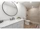 Modern bathroom with walk-in shower and updated vanity at 6306 W Mitchell Dr, Phoenix, AZ 85033