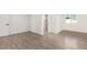 Bright bedroom with wood-look floors and en-suite bathroom at 6306 W Mitchell Dr, Phoenix, AZ 85033