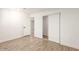 Bedroom with wood-look floors and ample closet space at 6306 W Mitchell Dr, Phoenix, AZ 85033