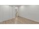 Spacious bedroom with double doors and built-in closet at 6306 W Mitchell Dr, Phoenix, AZ 85033