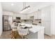 Modern kitchen with white cabinets and large island at 6306 W Mitchell Dr, Phoenix, AZ 85033