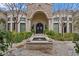 Elegant courtyard entry with fountain and stone details at 6322 E Turquoise Ave, Paradise Valley, AZ 85253