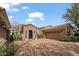 Stone and stucco home with a two car garage and gated entry at 6322 E Turquoise Ave, Paradise Valley, AZ 85253