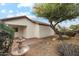 Landscaped backyard oasis with a water fountain at 7746 E Auburn St, Mesa, AZ 85207