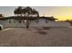 Newly painted gray house exterior with gravel landscaping at 8249 W Earll Dr, Phoenix, AZ 85033