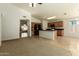 Open concept kitchen with island and view into living room at 915 W Spur Ave, Gilbert, AZ 85233