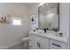 Stylish bathroom with a single vanity and a walk-in shower at 943 N 97Th Way, Mesa, AZ 85207