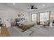 Spacious bedroom with plush bedding and seating area at 943 N 97Th Way, Mesa, AZ 85207