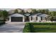 Craftsman style home with a two-car garage and landscaped yard at 943 N 97Th Way, Mesa, AZ 85207
