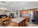 Kitchen with an island, stainless steel appliances, and wood cabinets at 9620 W Ruth Ave, Peoria, AZ 85345