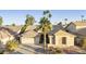 Single-story home with desert landscaping and two-car garage at 10050 E Coopers Hawk Dr, Sun Lakes, AZ 85248