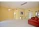 Spacious living room with neutral walls and carpet at 10334 W Highwood Ln, Sun City, AZ 85373