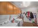 Laundry room with washer, dryer, and cabinets at 10719 E Lupine Ln, Florence, AZ 85132