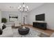 Bright living room with a modern aesthetic and a large TV at 10719 E Lupine Ln, Florence, AZ 85132