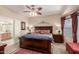 Main bedroom with ensuite bathroom and large bed at 10770 E Peralta Canyon Dr, Gold Canyon, AZ 85118