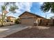 Exterior view of a two-story home with a two-car garage and driveway at 125 W Welsh Black Cir, San Tan Valley, AZ 85143