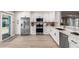 Modern kitchen with white cabinets and a marble countertop at 140 N 95Th Pl, Mesa, AZ 85207