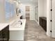 Spa-like bathroom with soaking tub, walk-in shower, and double vanity at 14139 W Gray Fox Trl, Surprise, AZ 85387
