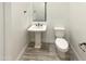 Clean and modern powder room with pedestal sink at 14139 W Gray Fox Trl, Surprise, AZ 85387