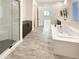 Luxurious bathroom with soaking tub and walk-in shower at 14139 W Gray Fox Trl, Surprise, AZ 85387