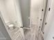 Simple bathroom with toilet and access to another room at 14139 W Gray Fox Trl, Surprise, AZ 85387